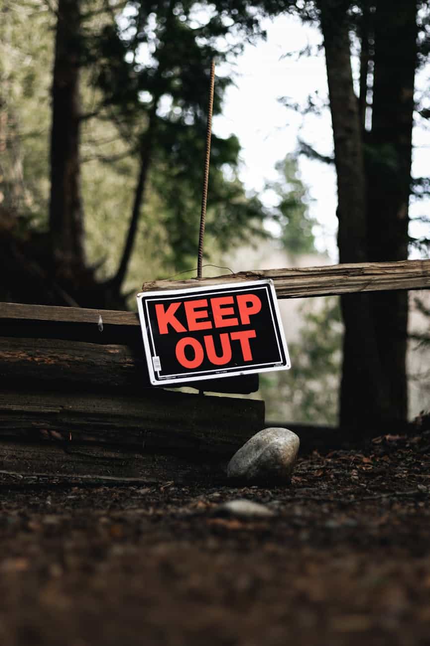 a keep out sign in a forest