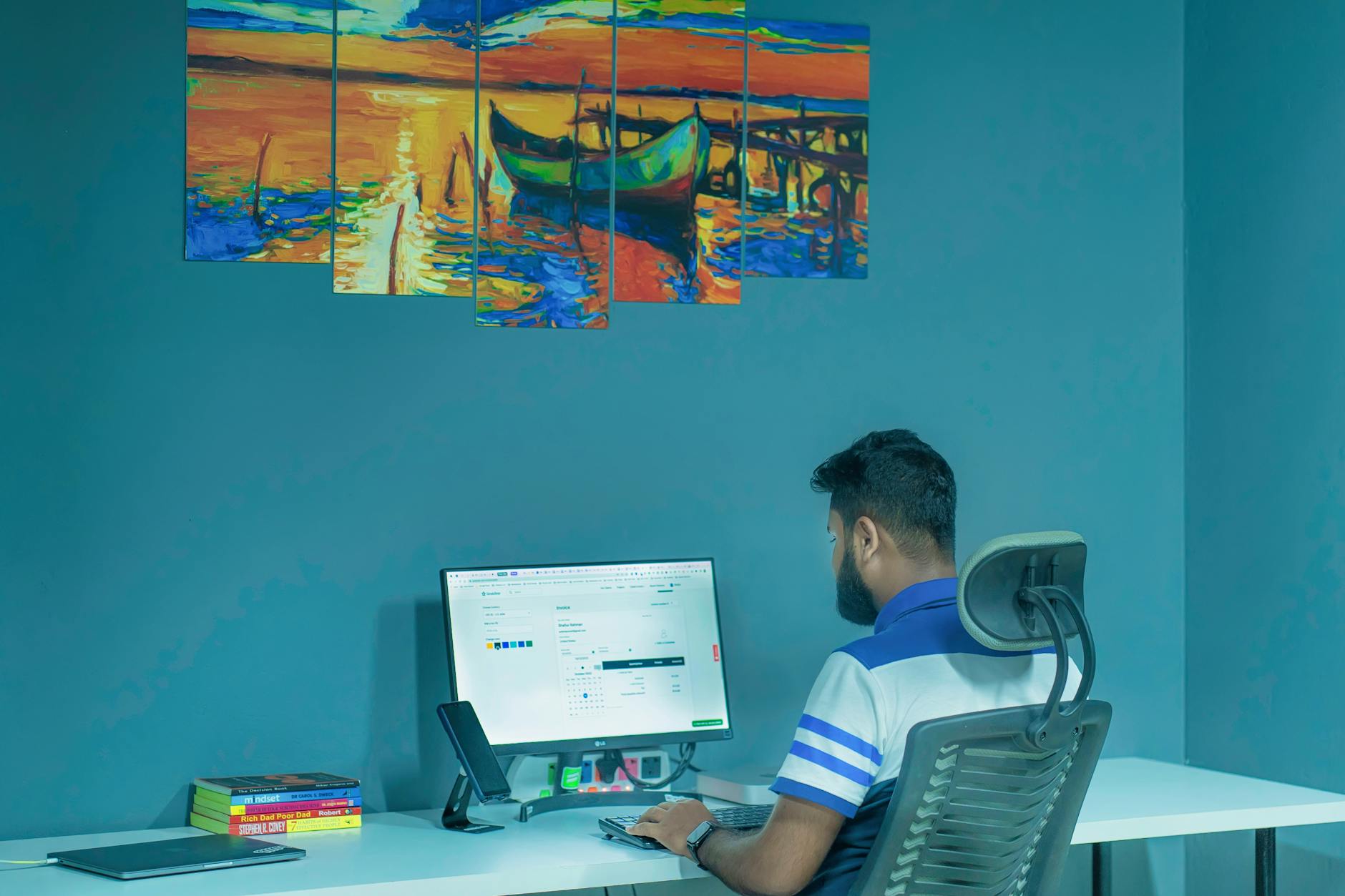 man working on pc in home office