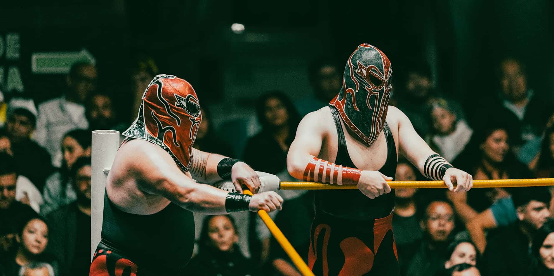 masked wrestlers in action at lucha libre event