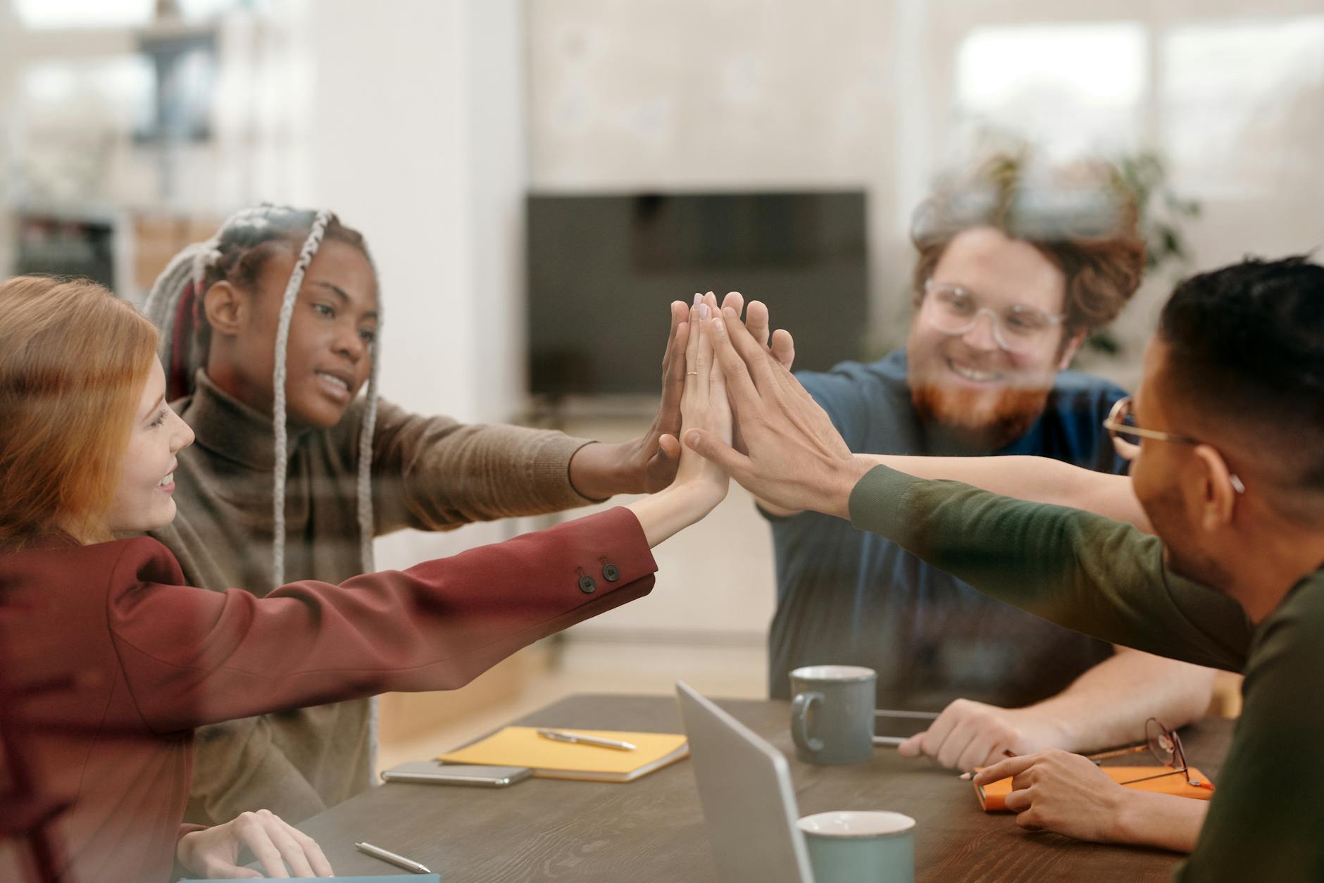 a people doing high five together