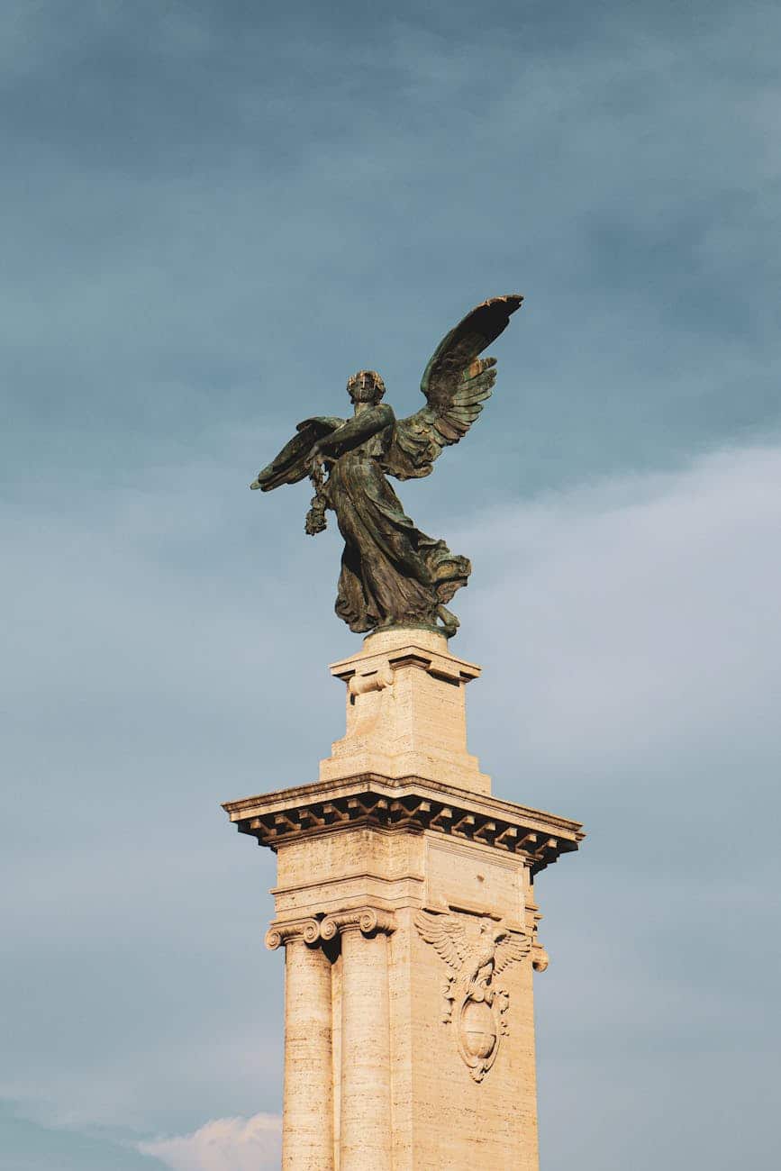 winged victory statue in rome against blue sky