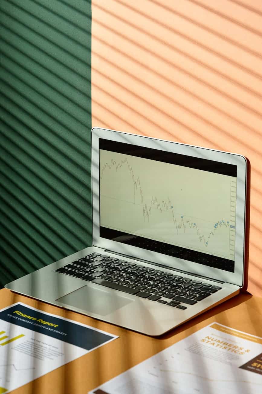 macbook air on brown wooden table with screen display