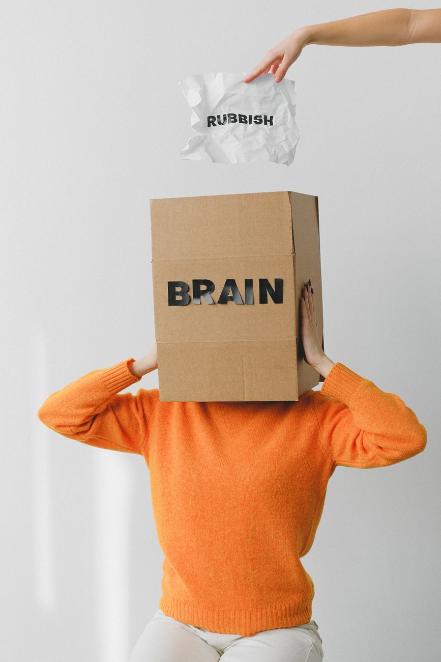 box with brain title on head of unrecognizable woman