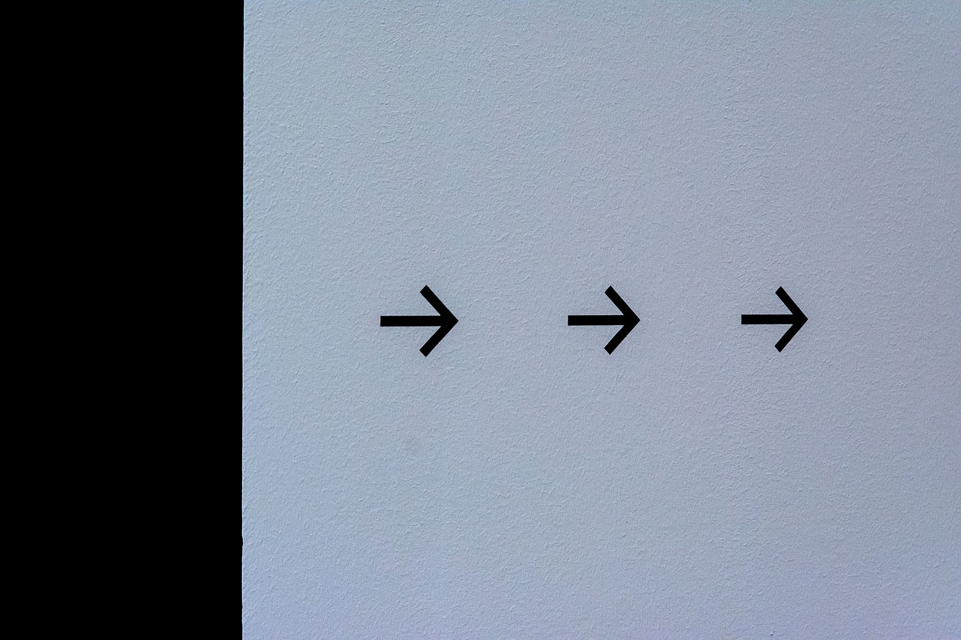 arrows on white wall
